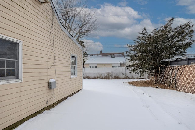 view of yard covered in snow