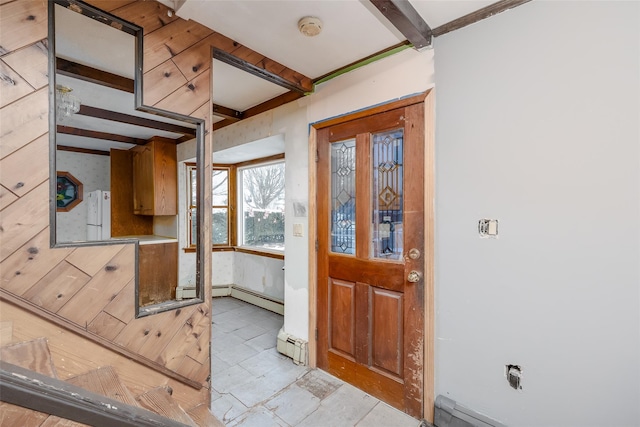 foyer entrance with beam ceiling and baseboard heating