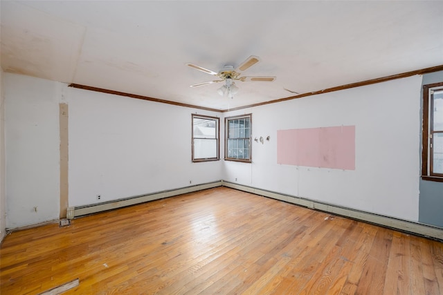 empty room featuring a baseboard heating unit, crown molding, light hardwood / wood-style flooring, and ceiling fan