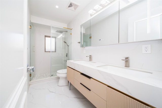 bathroom featuring vanity, toilet, and an enclosed shower