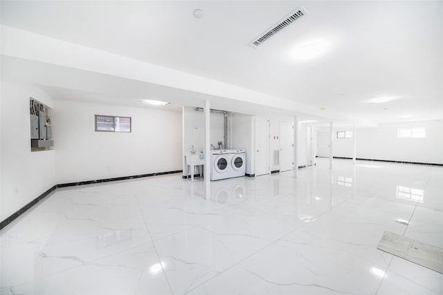 interior space featuring sink and washer and clothes dryer