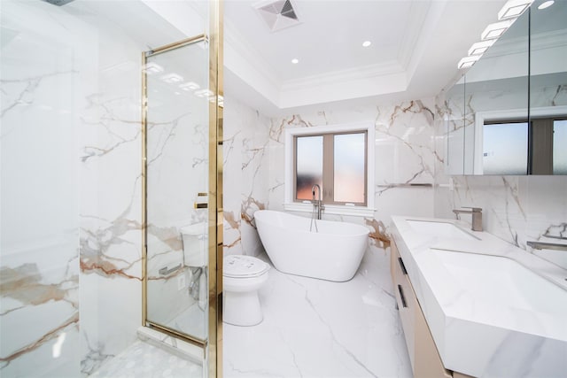 full bathroom featuring a tray ceiling, independent shower and bath, vanity, toilet, and crown molding