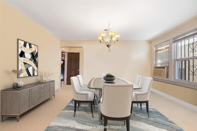 carpeted dining area with an inviting chandelier and cooling unit