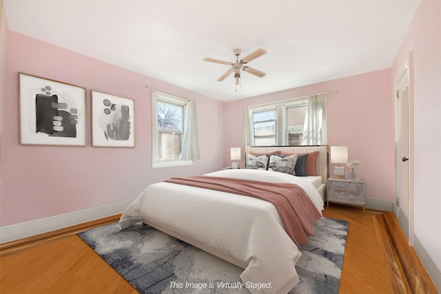 bedroom featuring hardwood / wood-style flooring and ceiling fan