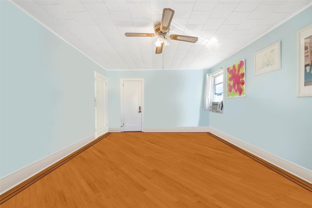 spare room featuring hardwood / wood-style flooring and ceiling fan