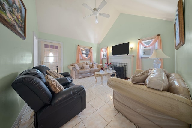 tiled living room with plenty of natural light, high vaulted ceiling, and ceiling fan