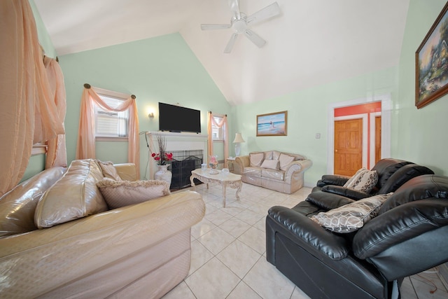 living room featuring high vaulted ceiling, ceiling fan, and light tile patterned flooring