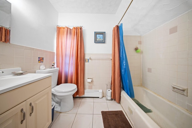 full bathroom featuring tile patterned floors, toilet, tile walls, vanity, and shower / bath combo