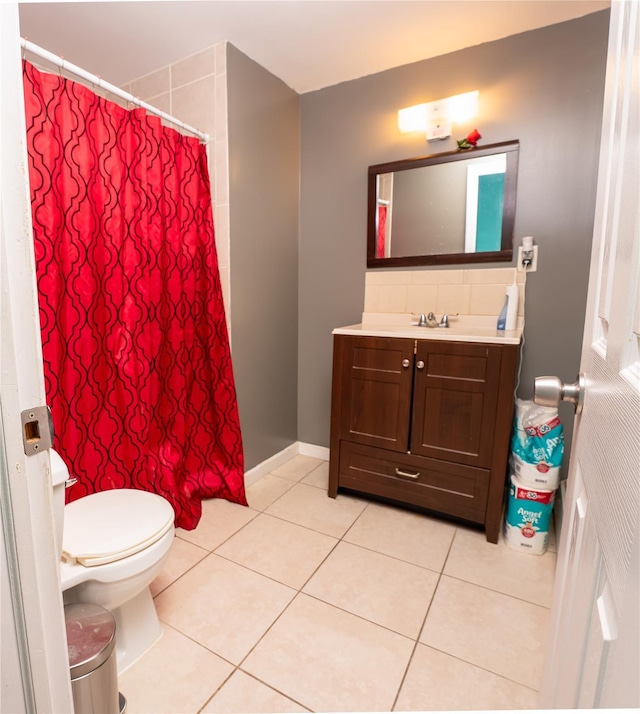 bathroom with vanity, tile patterned floors, and toilet