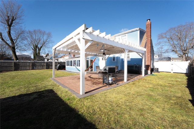 back of house featuring a yard, a pergola, a patio area, and ceiling fan