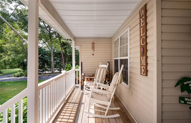 wooden deck featuring covered porch