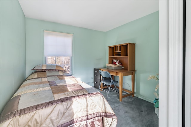 bedroom with dark colored carpet