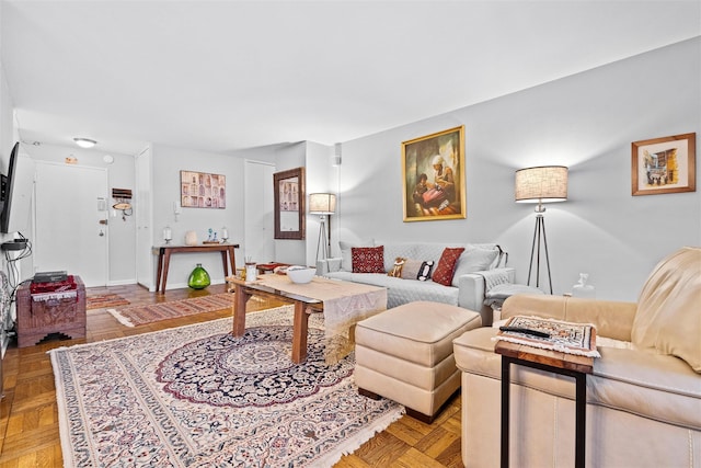 living room featuring parquet floors