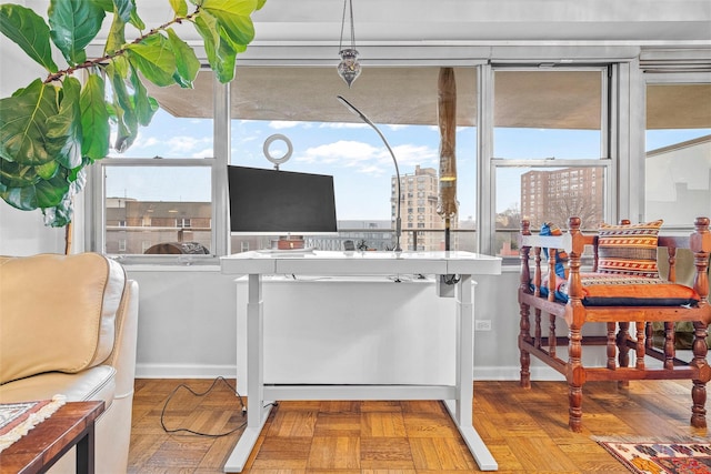 interior space featuring a healthy amount of sunlight and parquet floors