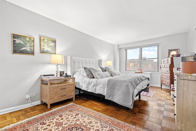 bedroom featuring parquet floors