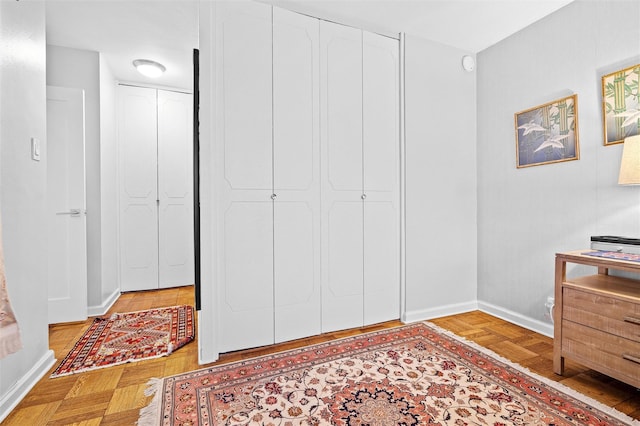 bedroom with light parquet floors