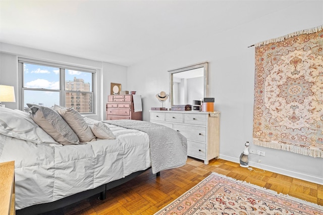 bedroom with light parquet floors