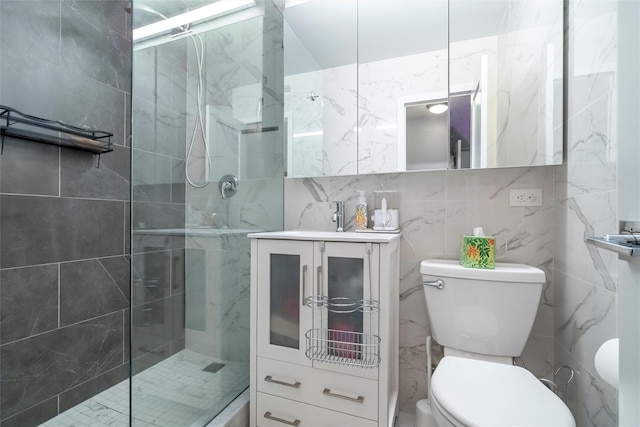 bathroom with toilet, an enclosed shower, tile walls, vanity, and decorative backsplash