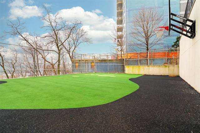 view of yard featuring basketball court