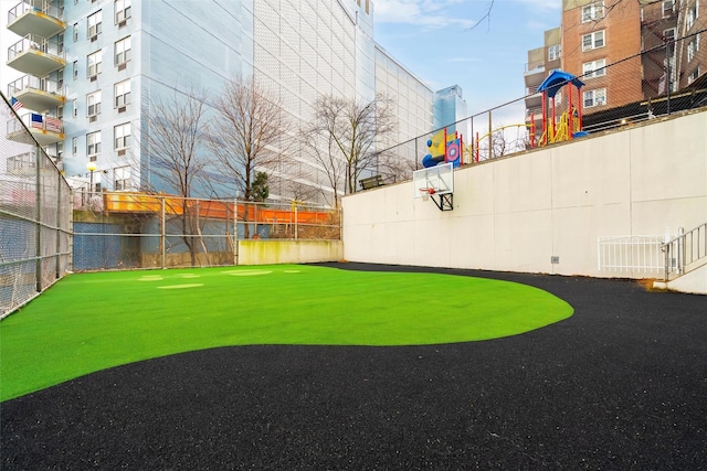 view of yard featuring basketball court