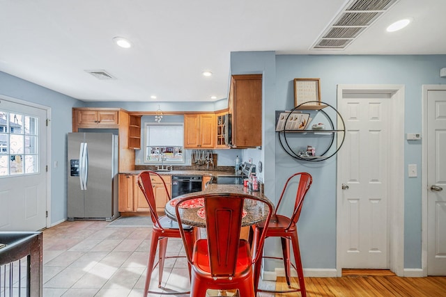 kitchen featuring stainless steel appliances, sink, and plenty of natural light