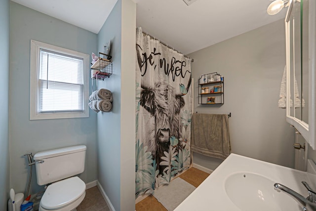 bathroom featuring toilet and sink