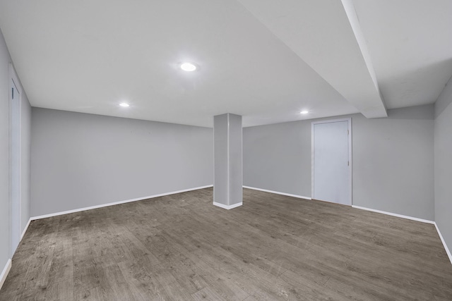 basement with dark wood-type flooring