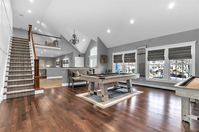 rec room featuring high vaulted ceiling, billiards, a chandelier, a baseboard heating unit, and dark wood-type flooring