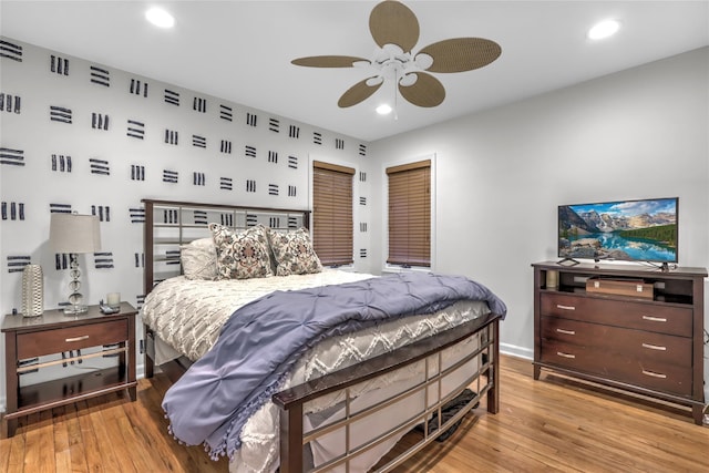 bedroom with ceiling fan and light wood-type flooring