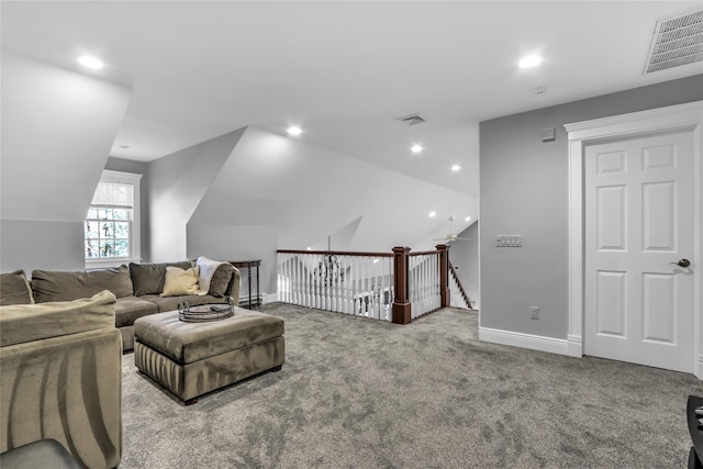 living room with lofted ceiling and carpet floors