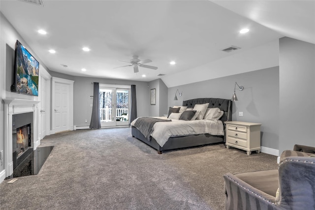 carpeted bedroom featuring ceiling fan, a baseboard radiator, and vaulted ceiling