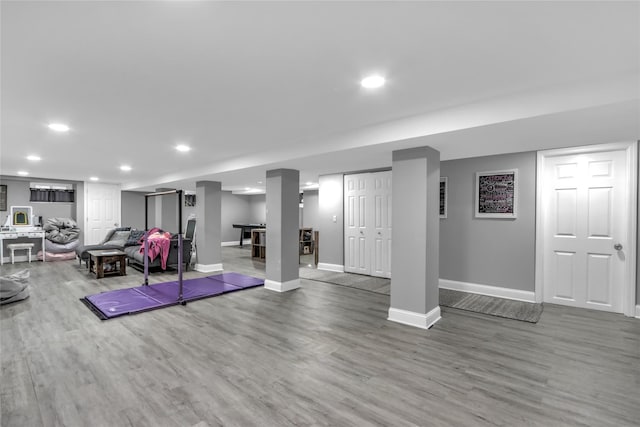 workout room with hardwood / wood-style floors