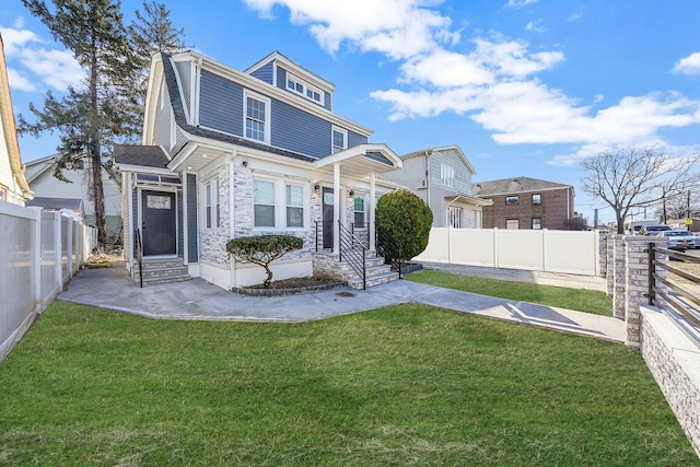 rear view of house featuring a lawn