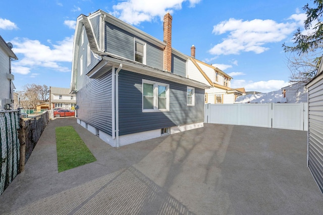 rear view of house featuring a patio