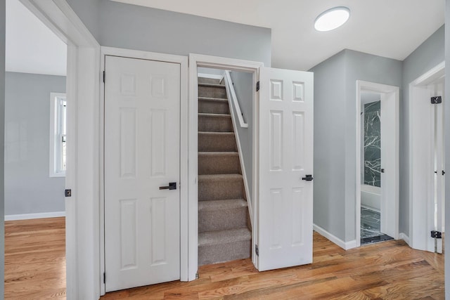 staircase featuring hardwood / wood-style floors