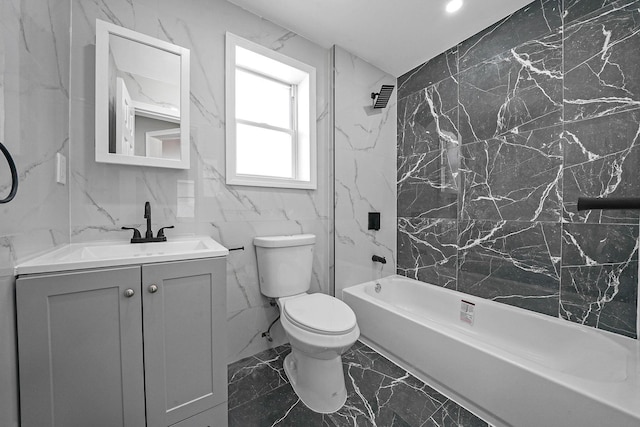 full bathroom featuring tiled shower / bath combo, vanity, and toilet