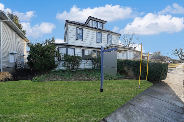 front facade with a front yard