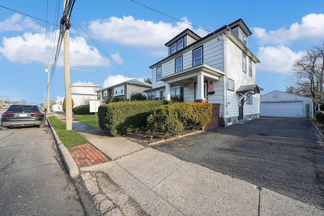 view of front facade with a garage and an outdoor structure