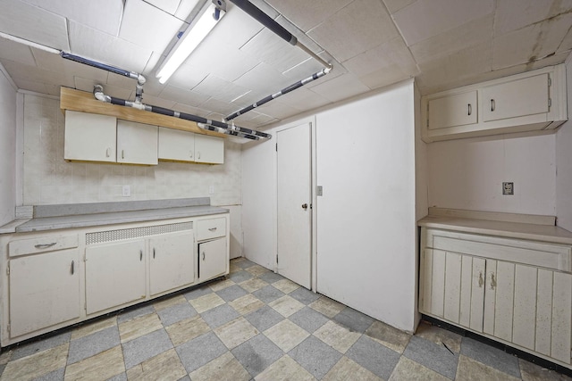 kitchen featuring white cabinets