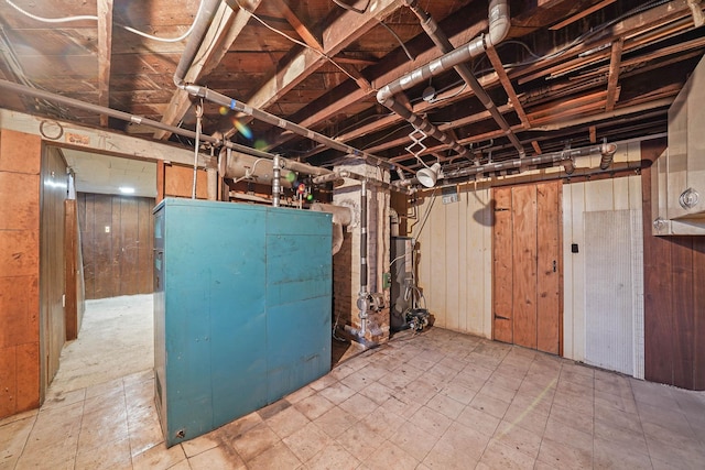 basement featuring wood walls