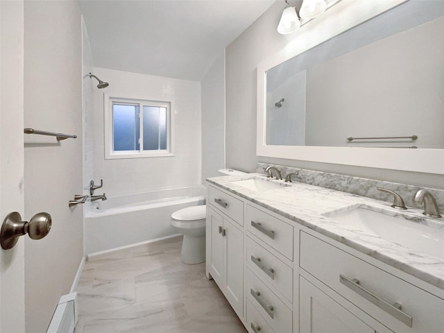 full bathroom featuring vanity, bathtub / shower combination, and toilet