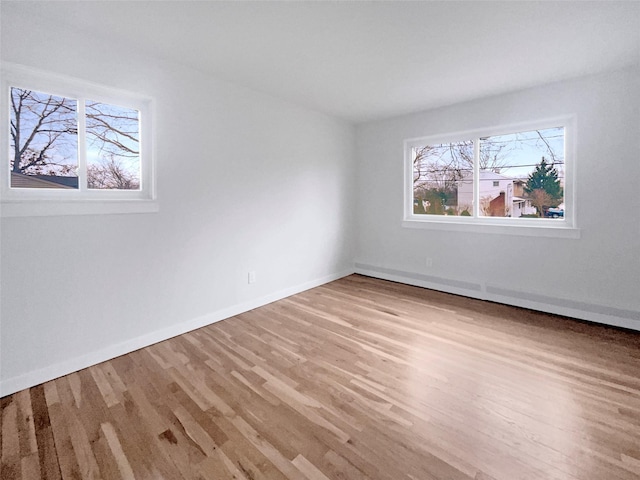 spare room featuring light hardwood / wood-style floors