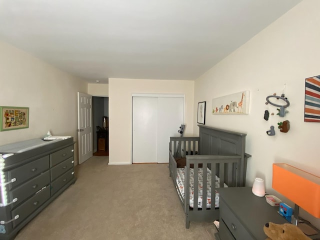 bedroom with carpet and a closet