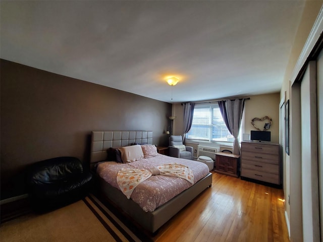 bedroom featuring light wood-style floors