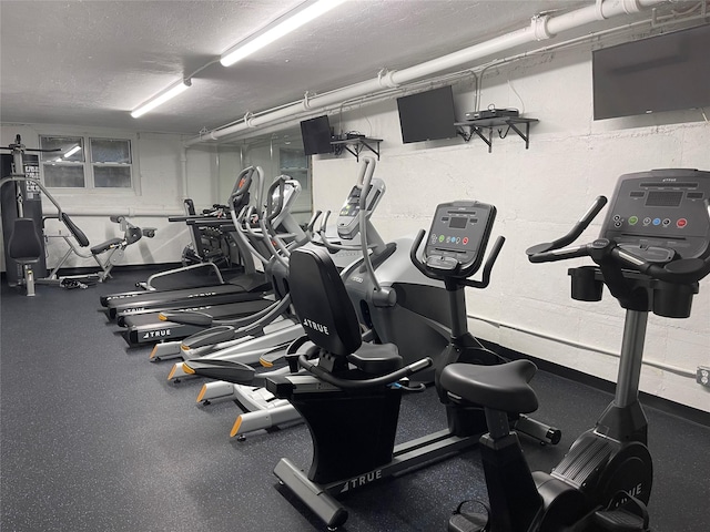 workout area with a textured ceiling