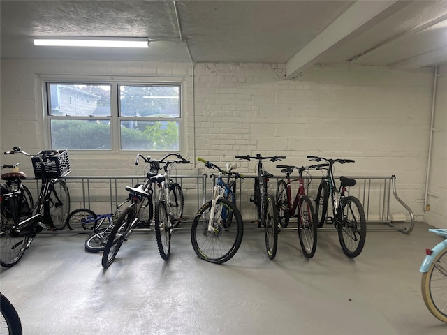 garage with concrete block wall and bike storage