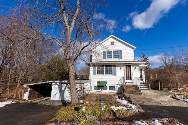 view of front property featuring a carport and a garage