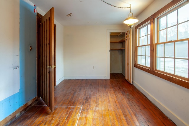 empty room with dark hardwood / wood-style floors