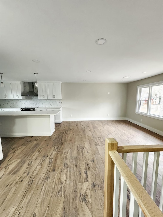 unfurnished living room with light wood-type flooring