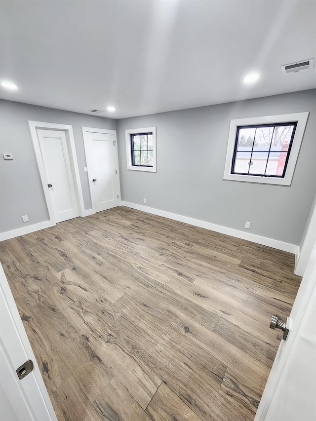 unfurnished room featuring hardwood / wood-style floors